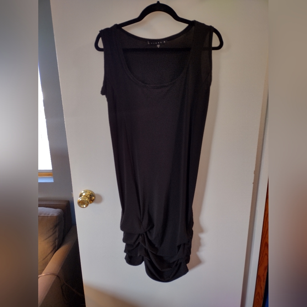 Tiana B. Size small black dress with cute dramatic bottom ruffle. Made in USA
